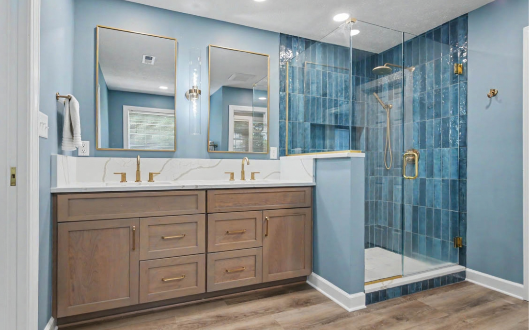 Yorktown bathroom remodel with vertical blue shower tile, frameless glass, and warm wood vanity