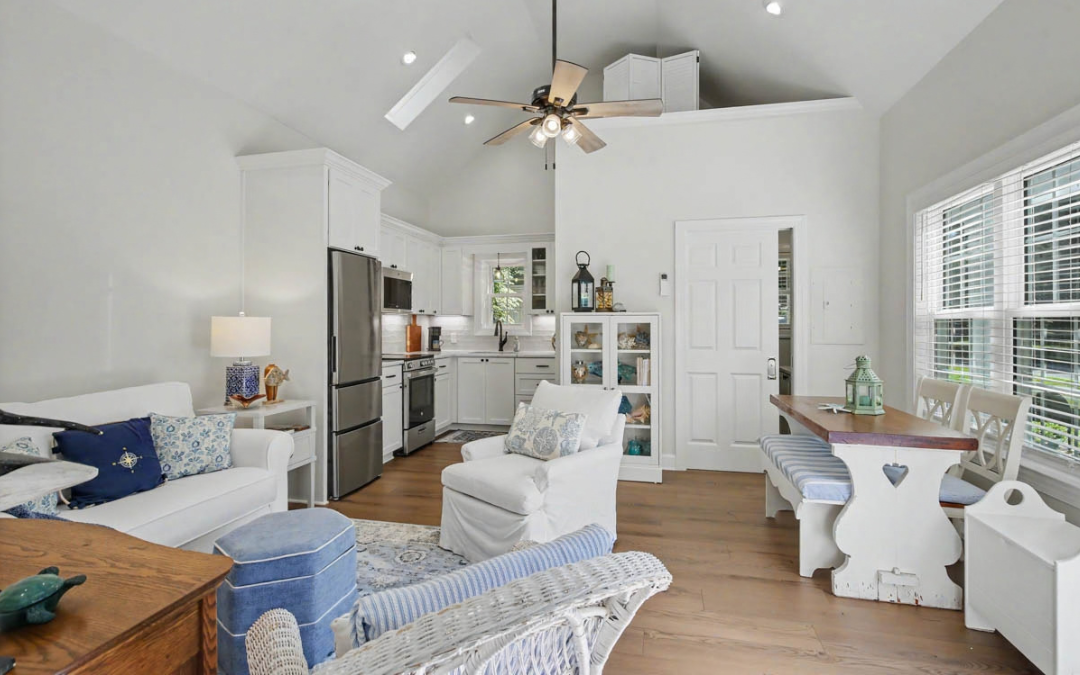 Yorktown backyard home addition with soft green siding, white trim, pergola, and patio